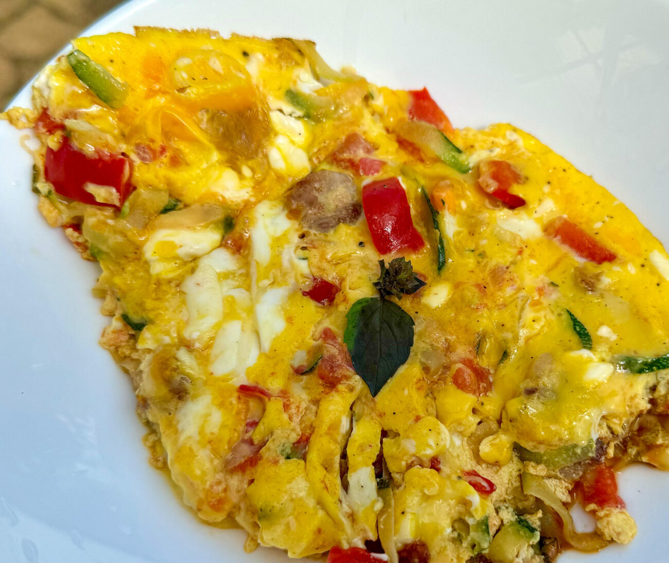 Tomato bacon and zucchini frittata