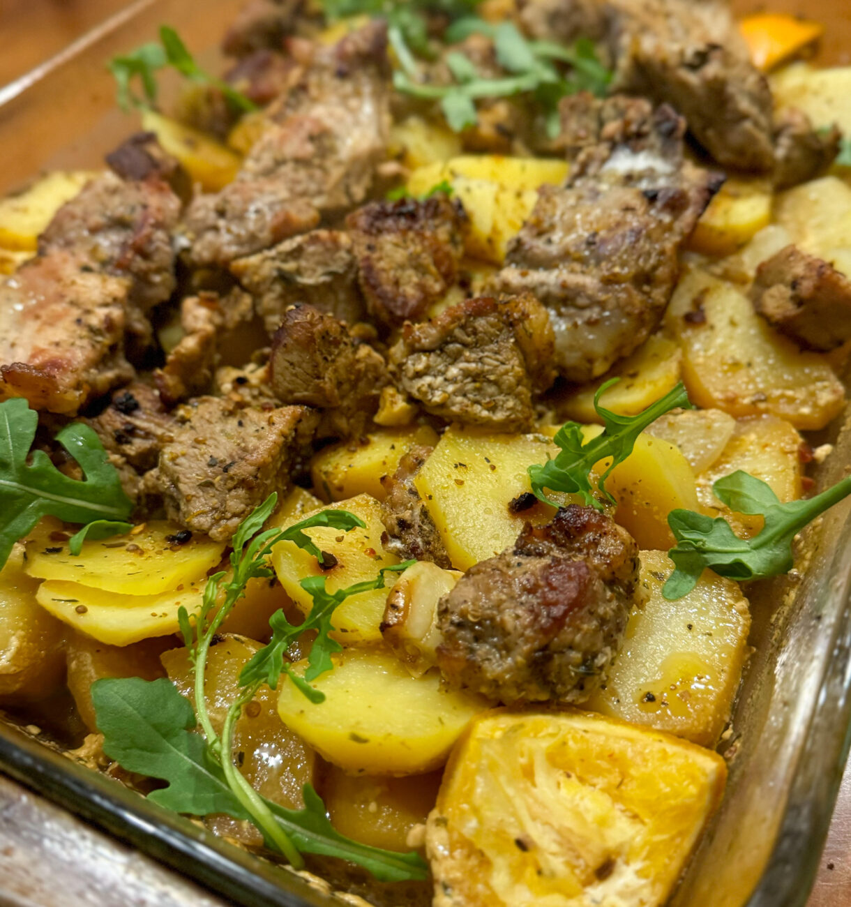 Roasted potatoes and meat in the oven