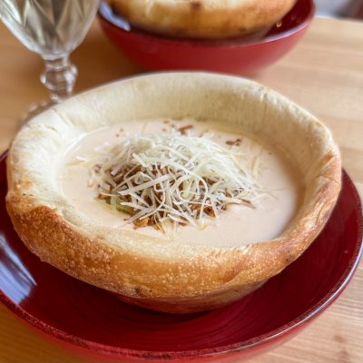 cheese soup served in a crispy bread bowl